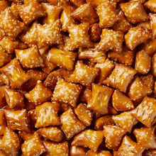 Peanut butter pretzel nuggets close-up, golden-brown with white salt-like specks