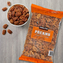Kirkland Signature pecan halves bag with a small bowl of pecans