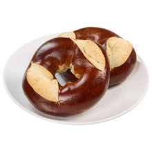 Kirkland Signature pretzel bagels on plate, cut in halves