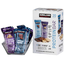 Protein bar variety pack with wrappers fanned beside the box
