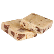 Two light tan protein bars with dark chocolate pieces