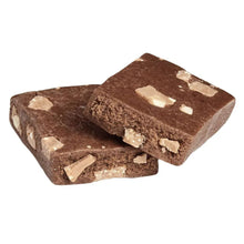 Chocolate protein bar pieces with visible white chunks