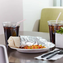 Aluminum foil sheet with folded edges, used to cover a prepared food dish