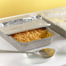 Aluminum foil-covered food tray with crimped foil top and clear lid