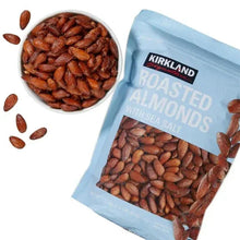 Roasted almonds with sea salt pouch with bowl of almonds and scattered almond pieces