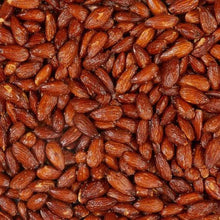 Close-up of roasted almonds with sea salt, brown almond pieces