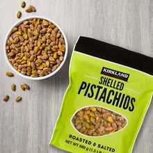 Roasted salted shelled pistachios with bag and bowl