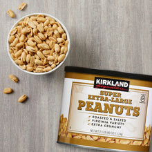 Roasted peanuts in a white bowl with Super Extra-Large Peanuts can