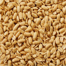 Extra-large roasted peanuts, golden-brown kernels piled close-up