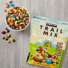 Bowl of trail mix with Kirkland Signature pouch beside it