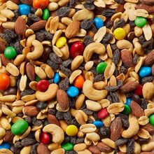 Close view of trail mix with nuts, raisins, and colorful candy pieces