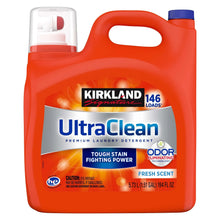 Liquid laundry detergent bottle with Kirkland Signature UltraClean label, orange, fresh scent