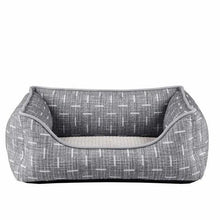 Gray wide-walled pet bed with curved front opening and patterned outer fabric