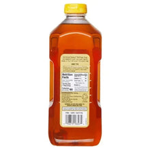 Wildflower honey bottle back label, amber liquid, yellow cap
