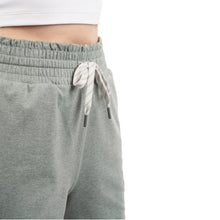 Women's lightweight green shorts detail: elastic waist and drawstring