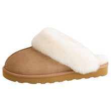 Tan suede slipper with a cream shearling strap and textured rubber sole
