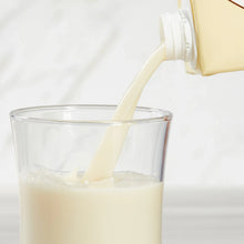 Almond beverage being poured into a glass
