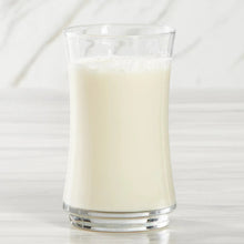 Vanilla almond beverage in clear glass with frothy top