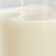 Pale creamy almond beverage liquid close-up with smooth surface