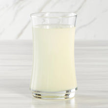 Organic lemonade in clear glass, pale yellow drink