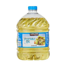 Vegetable oil bottle with blue cap, clear plastic, filled with golden oil