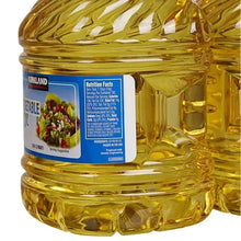 Vegetable oil bottle close-up showing blue label and nutrition facts