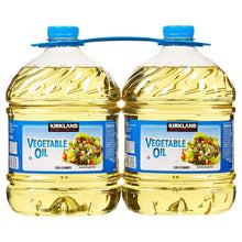 Vegetable oil twin bottles with blue caps, clear plastic, golden oil, front labels