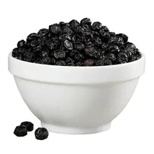 Whole dried dark blueberries in a white bowl