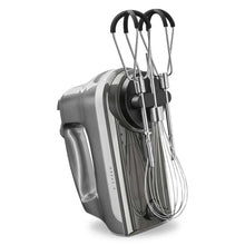 6-speed hand mixer with beaters and black flex rings, brushed metal body side view