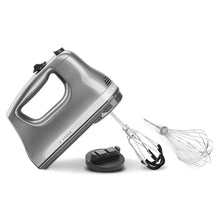 6-speed hand mixer with beaters, included whisk attachment, and base stand.