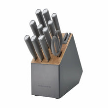 Charcoal gray storage block with upright steel knives in wooden slots