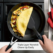Nonstick frying pan with black surface and long handle