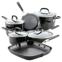 Hard anodized nonstick cookware set with black pots, pans, and glass lids