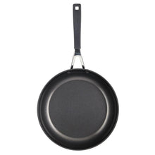 Round nonstick skillet with black interior and stainless bracket handle
