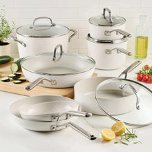 White ceramic nonstick cookware set with glass lids and long side handles