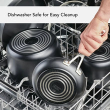 Dishwasher-safe black nonstick fry pans in a dishwasher rack