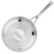 Stainless steel frying pan bottom with long handle, circular base label visible