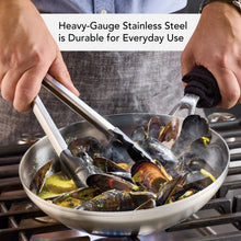 Stainless steel fry pan with mussels in sauce, long handle and wide rim
