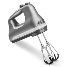 Hand mixer with stainless beaters, 6-speed dial on the metal body.