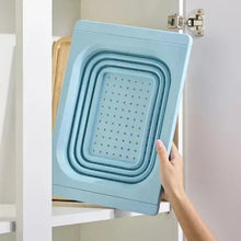 Collapsible colander, blue with nested perforated baskets and hinged frame