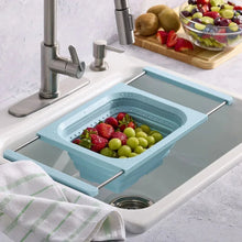 Collapsible colander, blue with perforated basket and side support handles