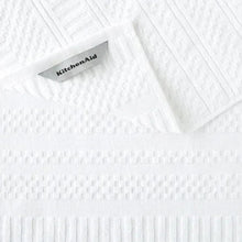 White cotton kitchen towel with textured waffle weave and KitchenAid label