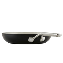 Dark ceramic nonstick fry pan with light interior and short silver handle