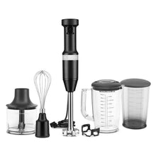 Black KitchenAid hand blender kit with beaker, whisk, and blending tools