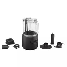 Cordless food chopper kit with clear jar, black base, and included blades/attachments