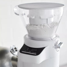KitchenAid sifter and scale attachment with hopper filled with flour and gauge panel