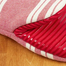 Striped oven mitt with red and white bands and hanging loop