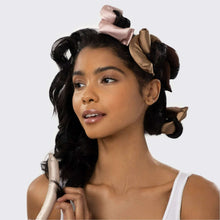 Satin-wrapped flexi hair curling rod in rosewood tones, worn on hair