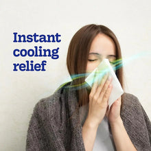 Kleenex cooling facial tissues, white sheet held to nose by person