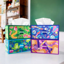 Set of two Kleenex tissue boxes with colorful patterns and open white tissues